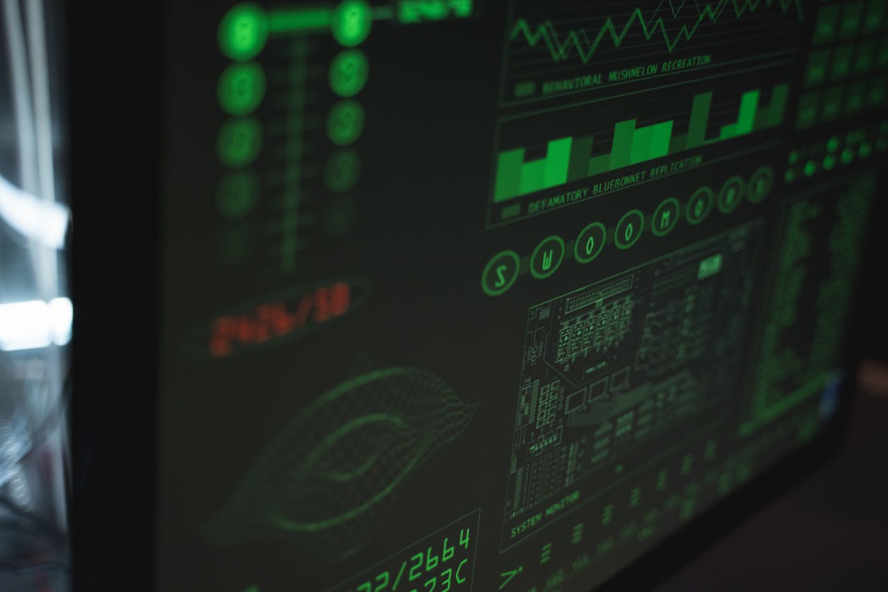 Close-up view of a computer displaying cybersecurity and data protection interfaces in green tones.